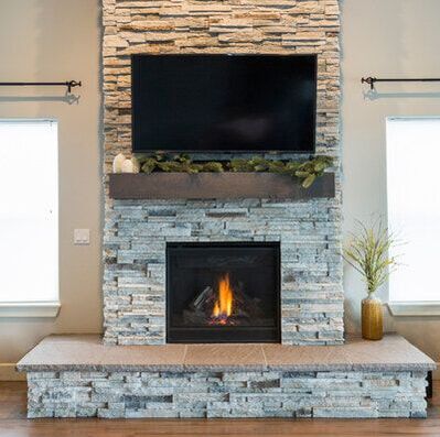 Light grey stone masonry fireplace in Oakville, Ontario